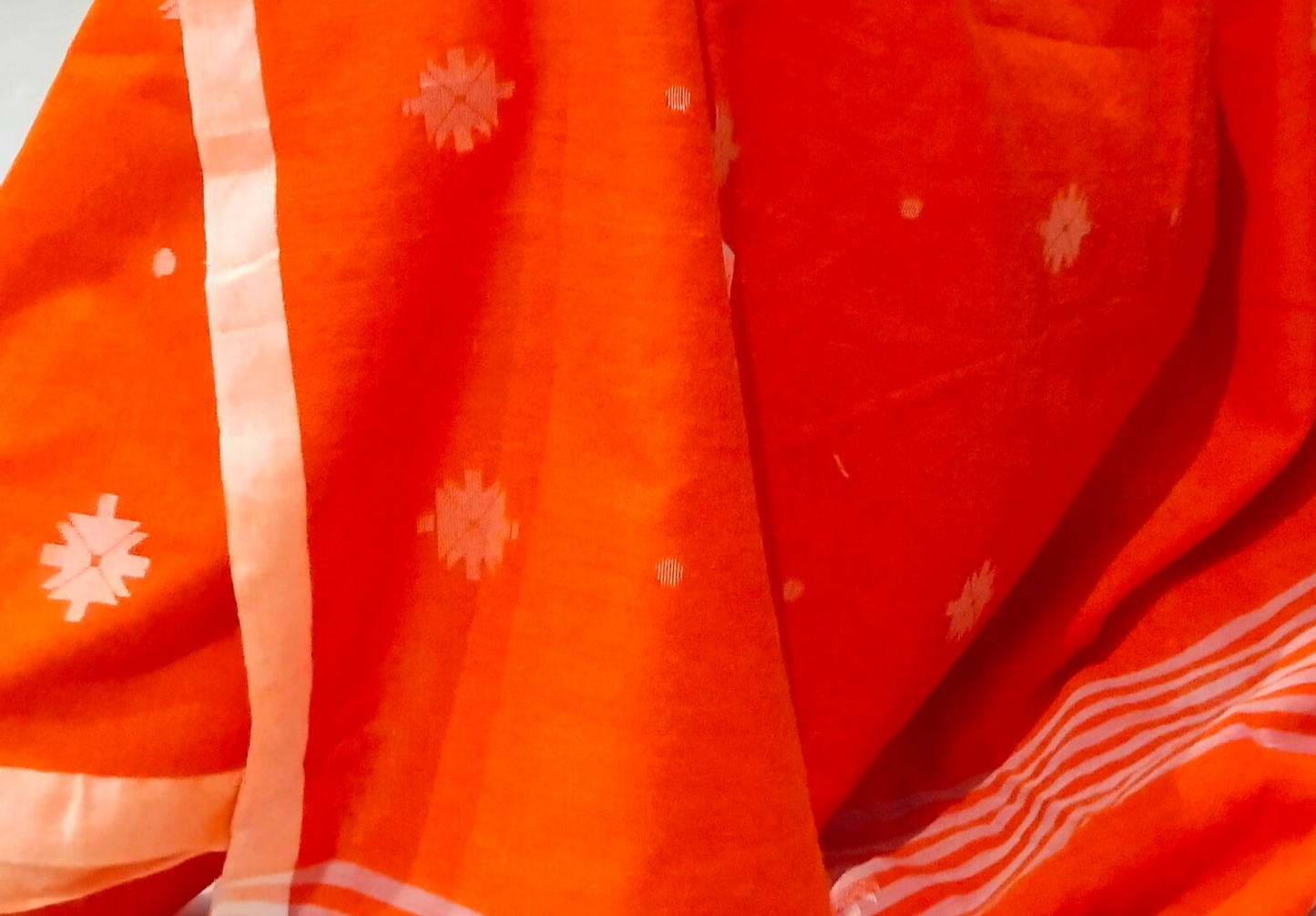 BRIGHT ORANGE-KHADI COTTON SAREE WITH THREAD WOVEN FLORAL BUTTAS AND SIMPLE BORDER