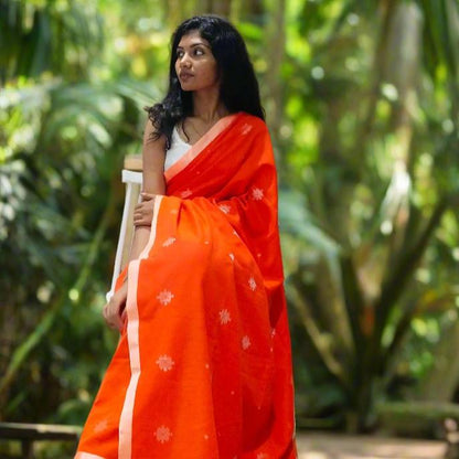 BRIGHT ORANGE-KHADI COTTON SAREE WITH THREAD WOVEN FLORAL BUTTAS AND SIMPLE BORDER
