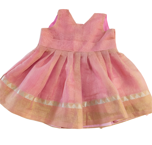 a pink tissue linen sleeveless frock with V-neck, gold zari border